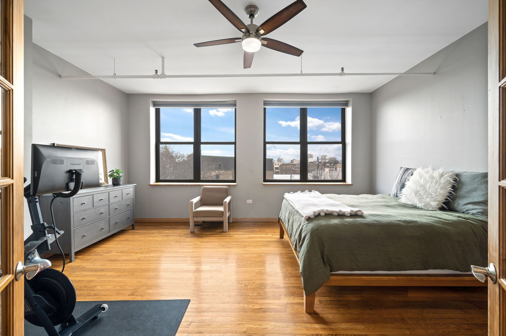 1101 West Armitage Avenue, Unit 204 Chicago, IL 60614 - Photo 9 of 17 a bedroom with a bed and a large window