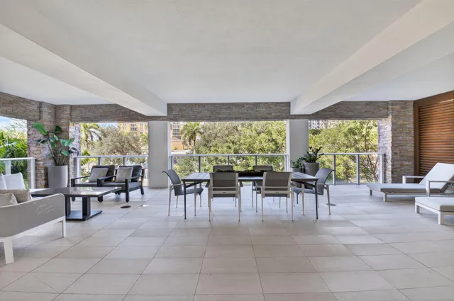 a room with lots of tables and chairs