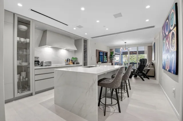 a kitchen with cabinets a sink and appliances