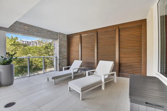 a view of two chairs in the balcony