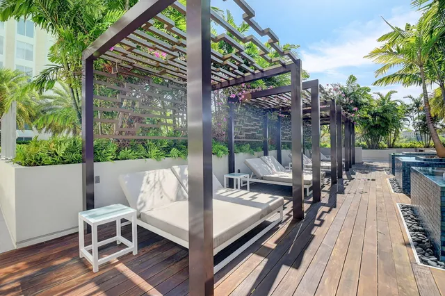 a view of balcony with chairs and wooden floor