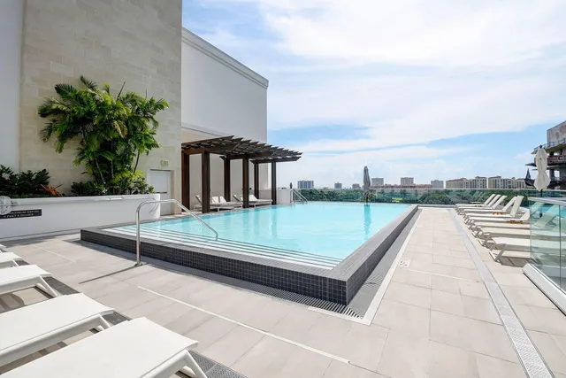a view of swimming pool with a lounge chair