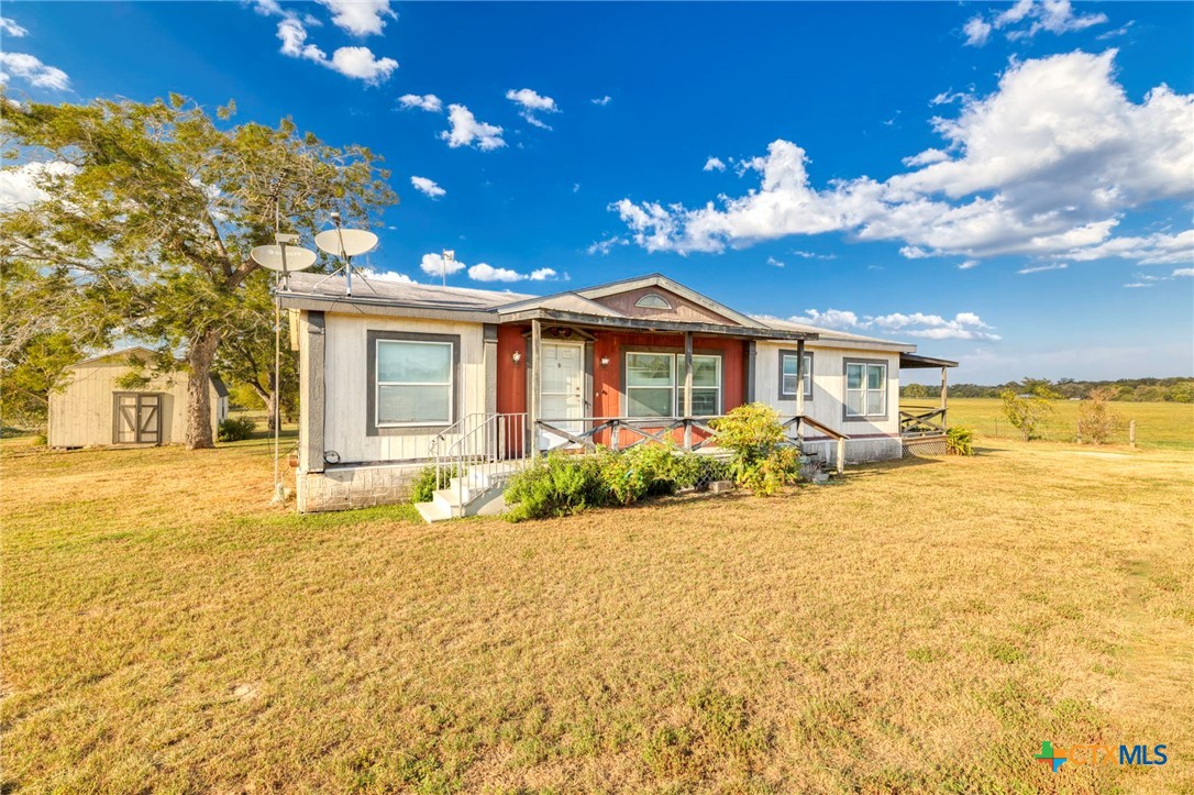 14858 Farm To Market Road 1322 Luling, TX 78648 - Photo 2 of 40 a house with a swimming pool