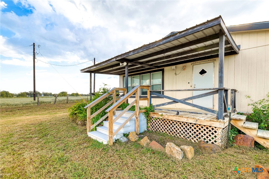 14858 Farm To Market Road 1322 Luling, TX 78648 - Photo 35 of 40 a roof deck view with a garden
