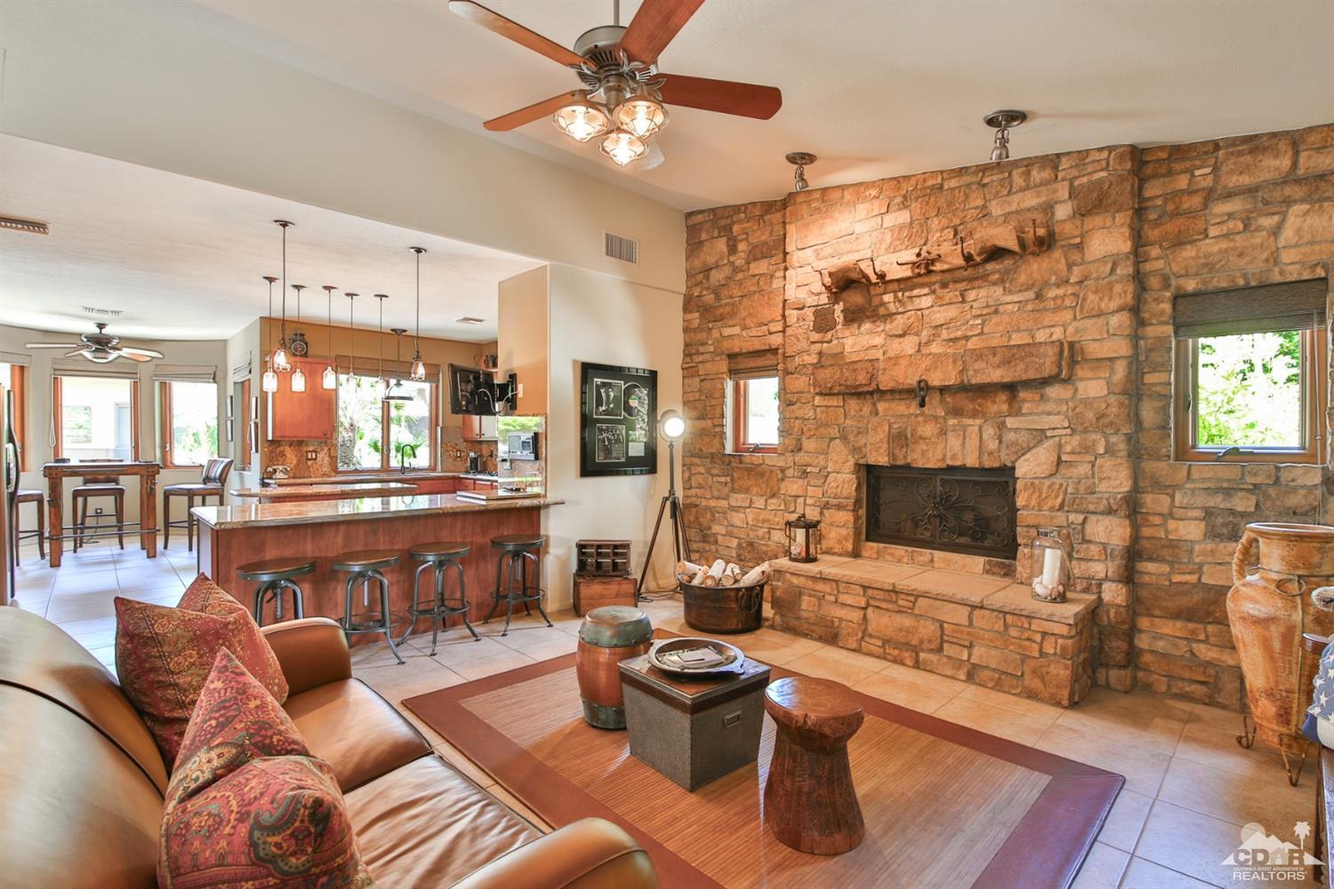 72187 Rancho Road Rancho Mirage, CA 92270 - Photo 11 of 25 a living room with furniture and a fireplace