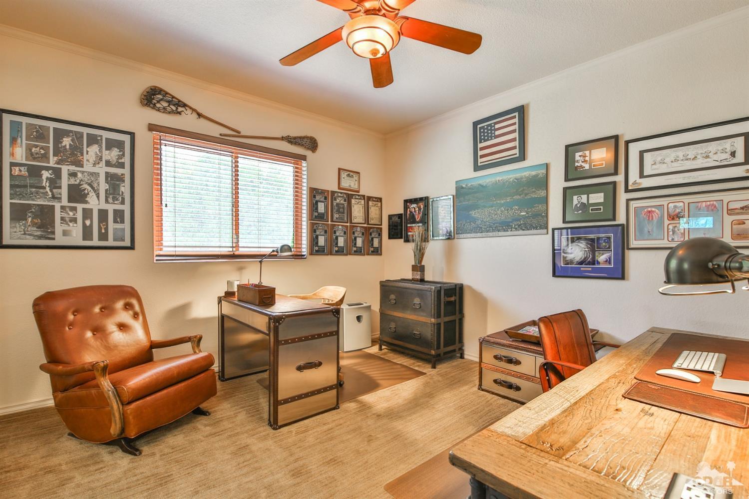 72187 Rancho Road Rancho Mirage, CA 92270 - Photo 19 of 25 a living room with furniture ceiling fan and a window