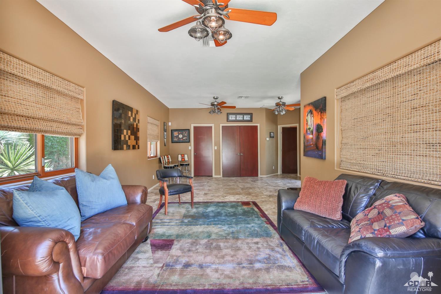 72187 Rancho Road Rancho Mirage, CA 92270 - Photo 20 of 25 a living room with furniture and a rug