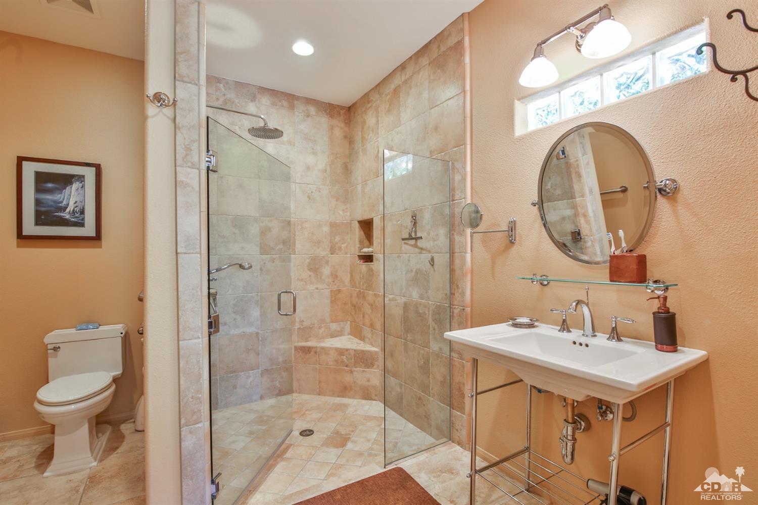 72187 Rancho Road Rancho Mirage, CA 92270 - Photo 22 of 25 a bathroom with a sink a toilet and shower