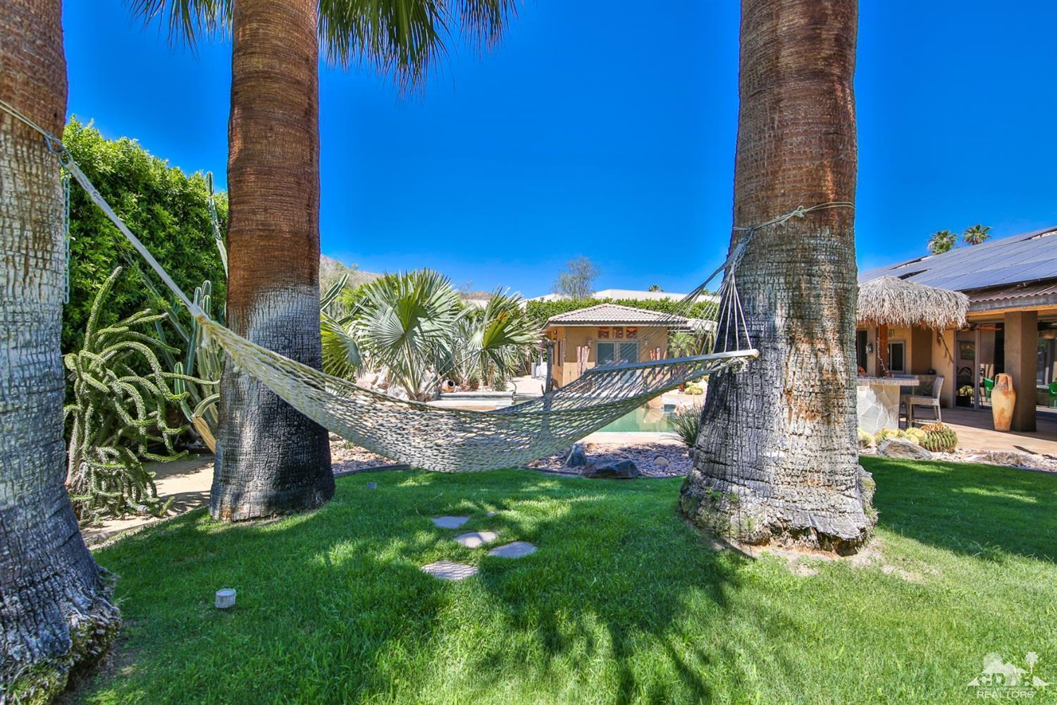 72187 Rancho Road Rancho Mirage, CA 92270 - Photo 25 of 25 a view of a backyard with plants and a patio