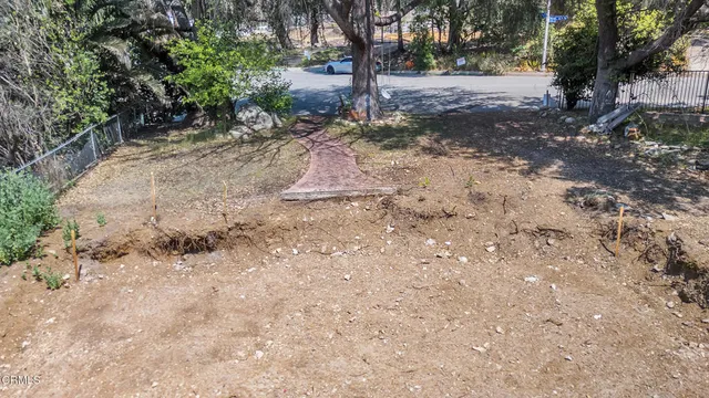 a backyard of a house with lots of green space
