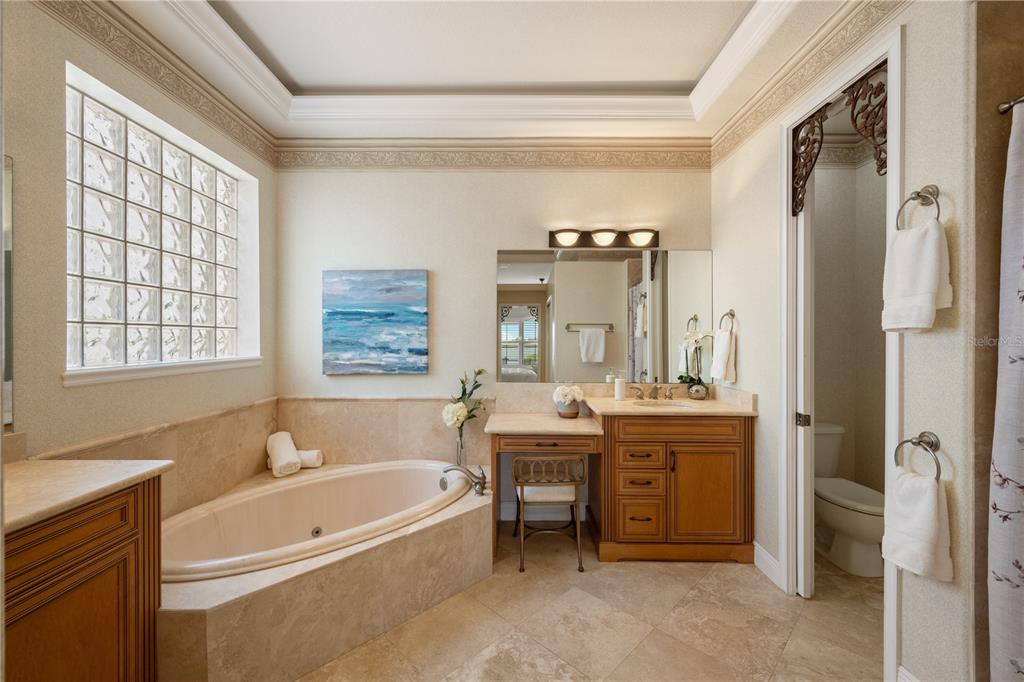 8119 Vía Rosa Orlando, FL 32836 - Photo 21 of 62 a spacious bathroom with a tub sink shower and mirror