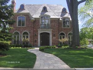 1011 Bluff Road Glencoe, IL 60022 - Photo 1 of 1 a front view of a house with garden
