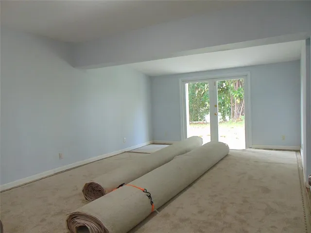 a view of room with window and ceiling fan