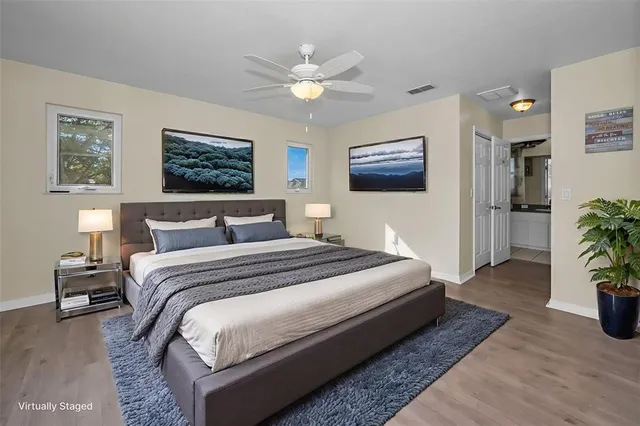 an aerial view of residential houses with outdoor space and lake view