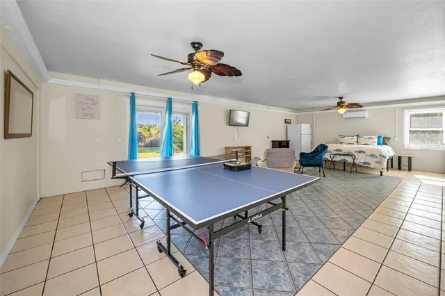 a view of a house with a yard and tree