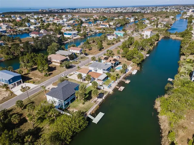 a view of a balcony with wooden floor and lake view