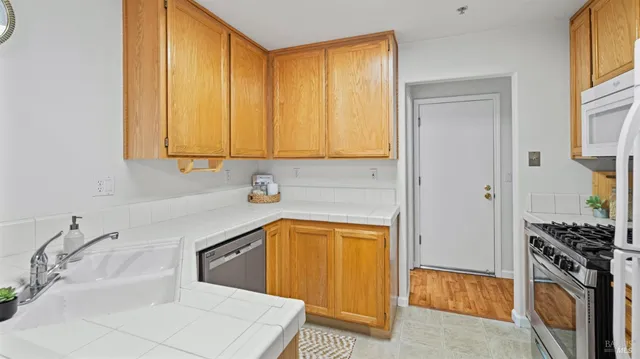 a bathroom with a sink a washer and dryer