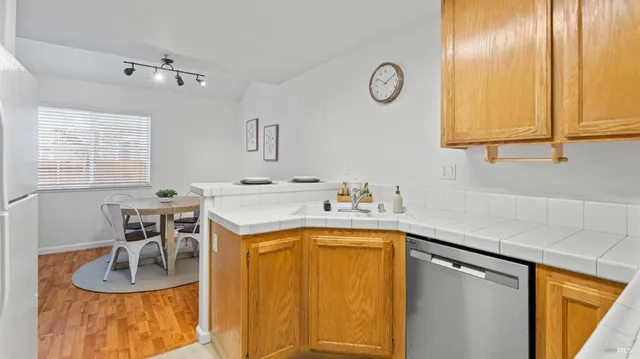 a kitchen with a sink cabinets and window