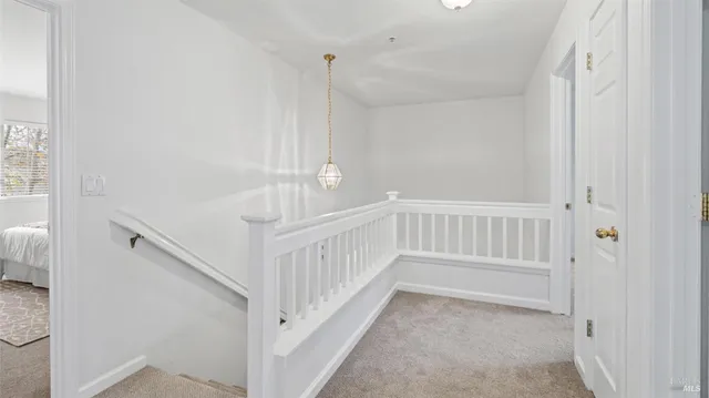 a view of a hallway with stairs