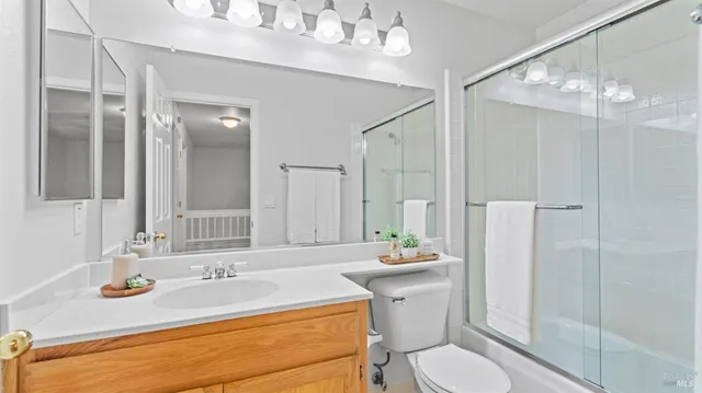 a bedroom with a bed and a potted plant