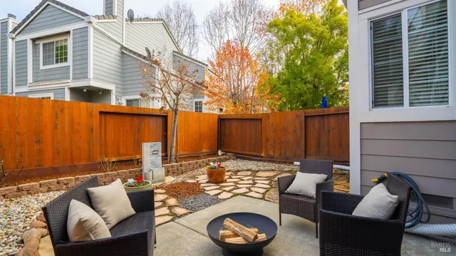 a view of a bench in front of house