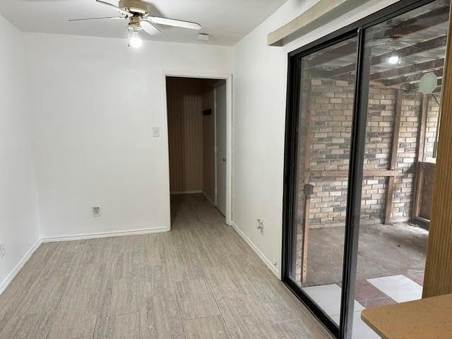 3413 Apollo Road Garland, TX 75044 - Photo 12 of 19 wooden floor in an empty room with a window
