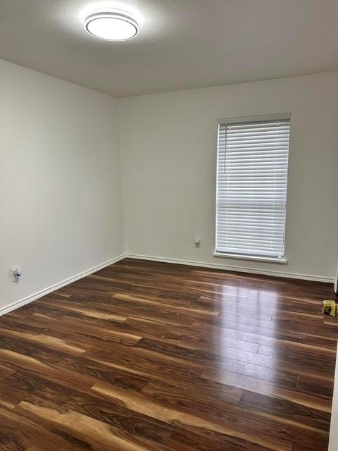 3413 Apollo Road Garland, TX 75044 - Photo 16 of 19 a view of empty room with window and wooden floor