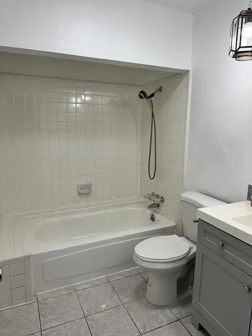 a bathroom with a toilet a sink and a shower