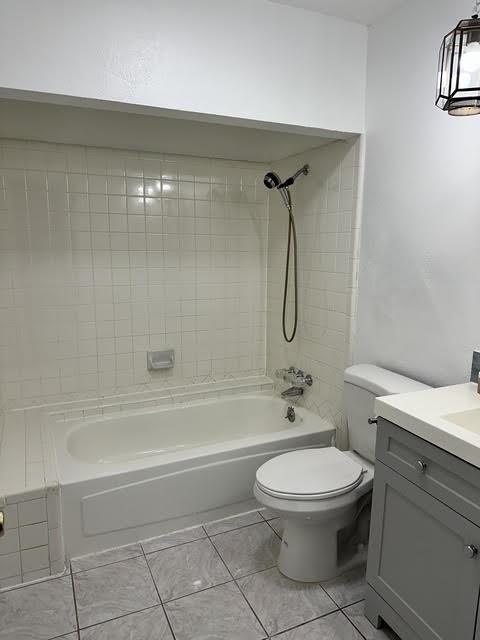 3413 Apollo Road Garland, TX 75044 - Photo 19 of 19 a bathroom with a toilet a sink and a shower