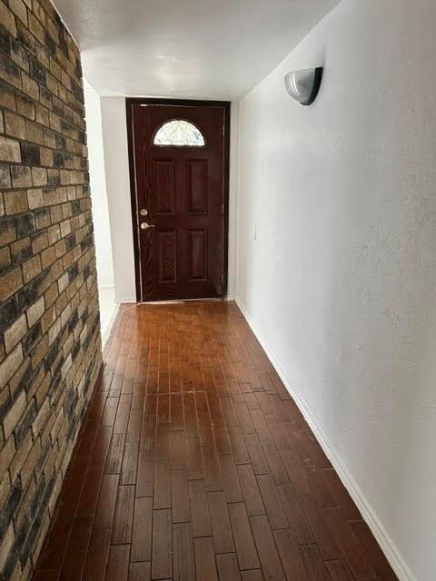 3413 Apollo Road Garland, TX 75044 - Photo 9 of 19 a view of a hallway with wooden floor