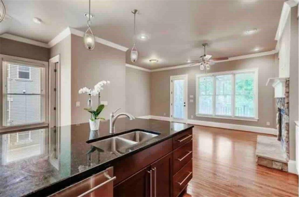384 16th Street Northwest, Unit 1 Atlanta, GA 30363 - Photo 14 of 31 a kitchen with a counter space a sink and chandelier