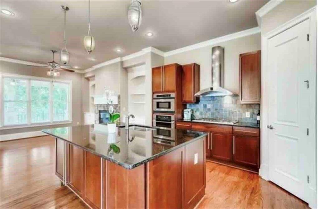 384 16th Street Northwest, Unit 1 Atlanta, GA 30363 - Photo 16 of 31 a kitchen with stainless steel appliances granite countertop a sink and a refrigerator