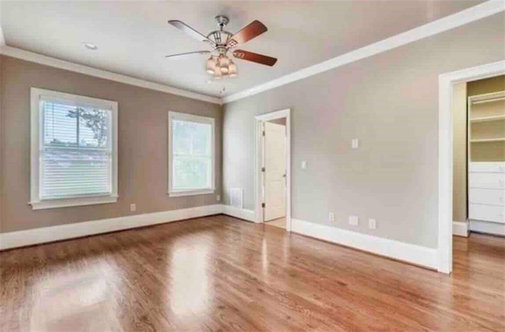 384 16th Street Northwest, Unit 1 Atlanta, GA 30363 - Photo 20 of 31 wooden floor in an empty room with a window