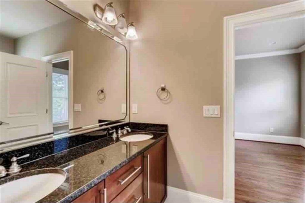 384 16th Street Northwest, Unit 1 Atlanta, GA 30363 - Photo 23 of 31 a bathroom with a sink and a mirror