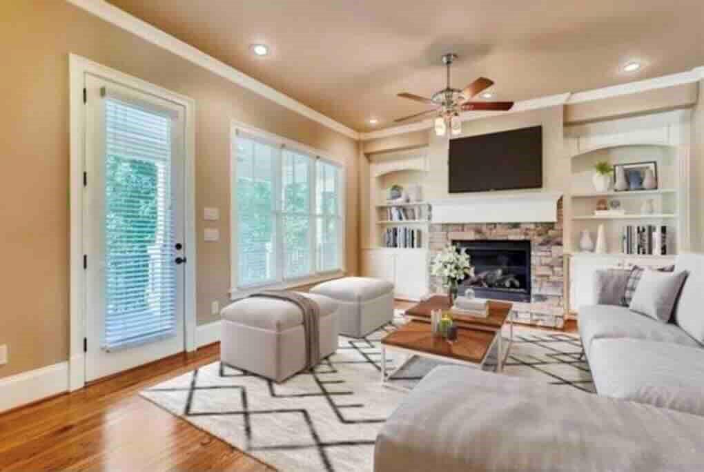 384 16th Street Northwest, Unit 1 Atlanta, GA 30363 - Photo 3 of 31 a living room with furniture a flat screen tv and a fireplace