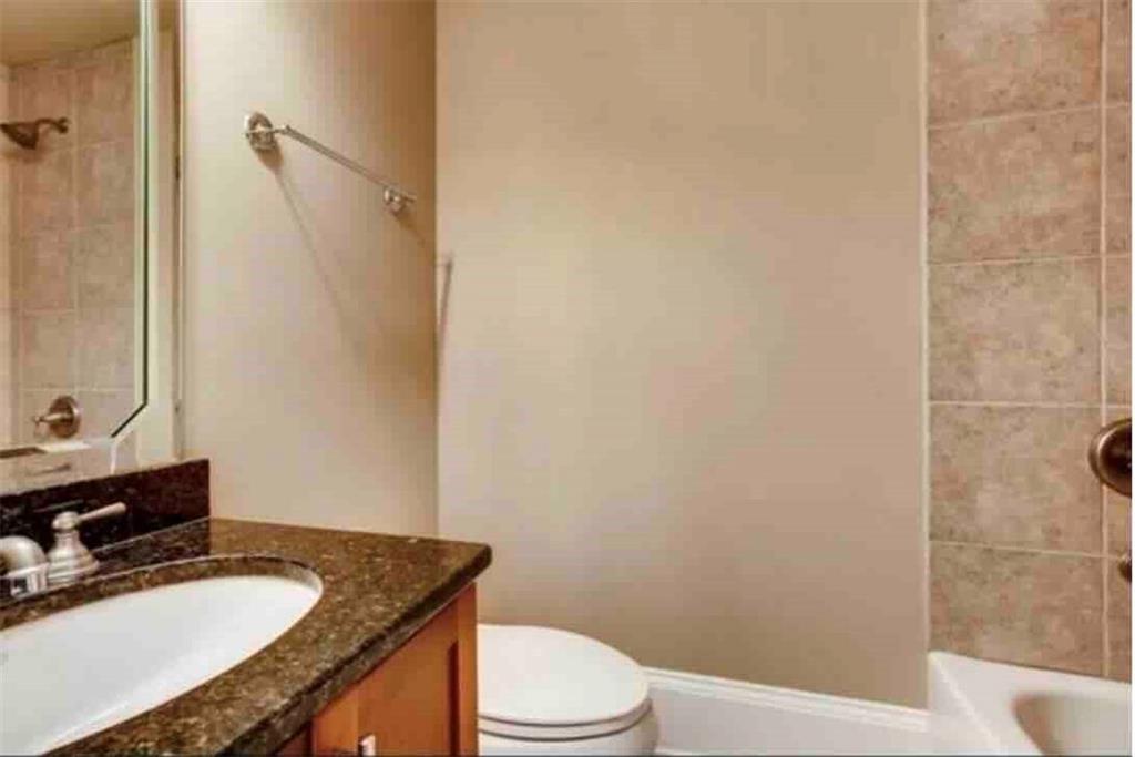 384 16th Street Northwest, Unit 1 Atlanta, GA 30363 - Photo 6 of 31 a bathroom with a granite countertop sink toilet and shower