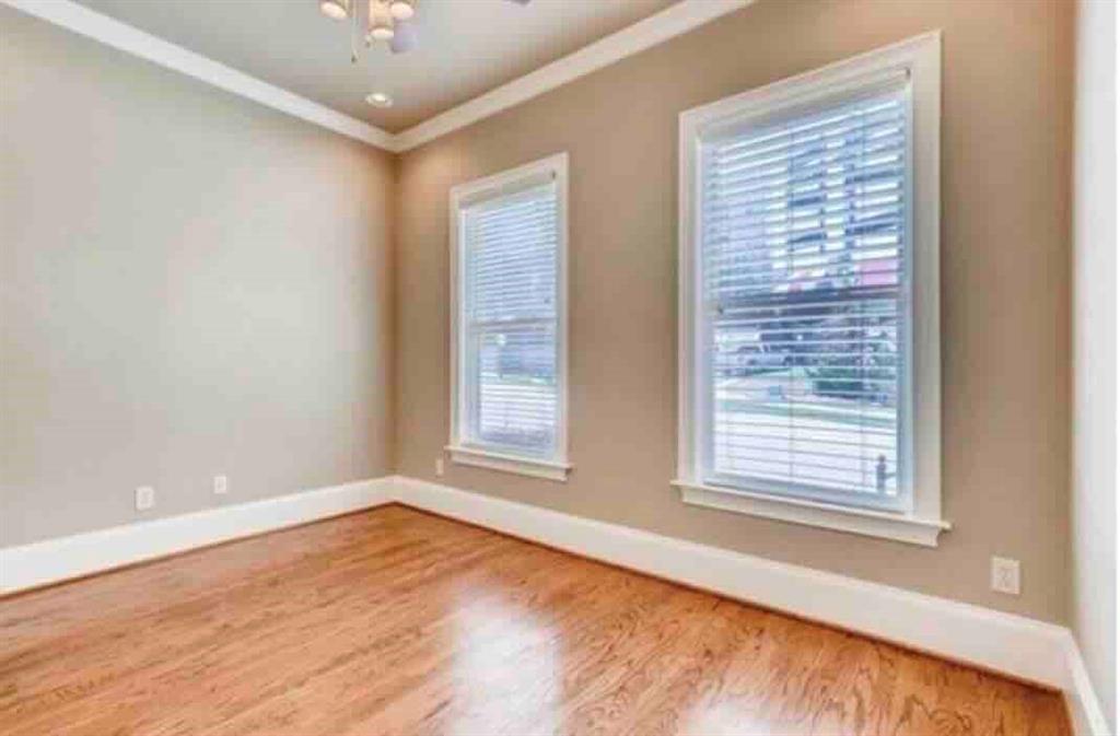 384 16th Street Northwest, Unit 1 Atlanta, GA 30363 - Photo 7 of 31 an empty room with wooden floor and windows