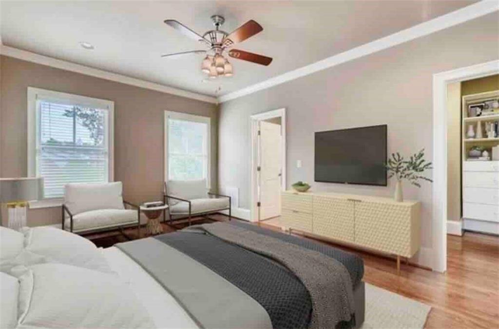 384 16th Street Northwest, Unit 1 Atlanta, GA 30363 - Photo 10 of 31 a bedroom with a bed and a flat screen tv