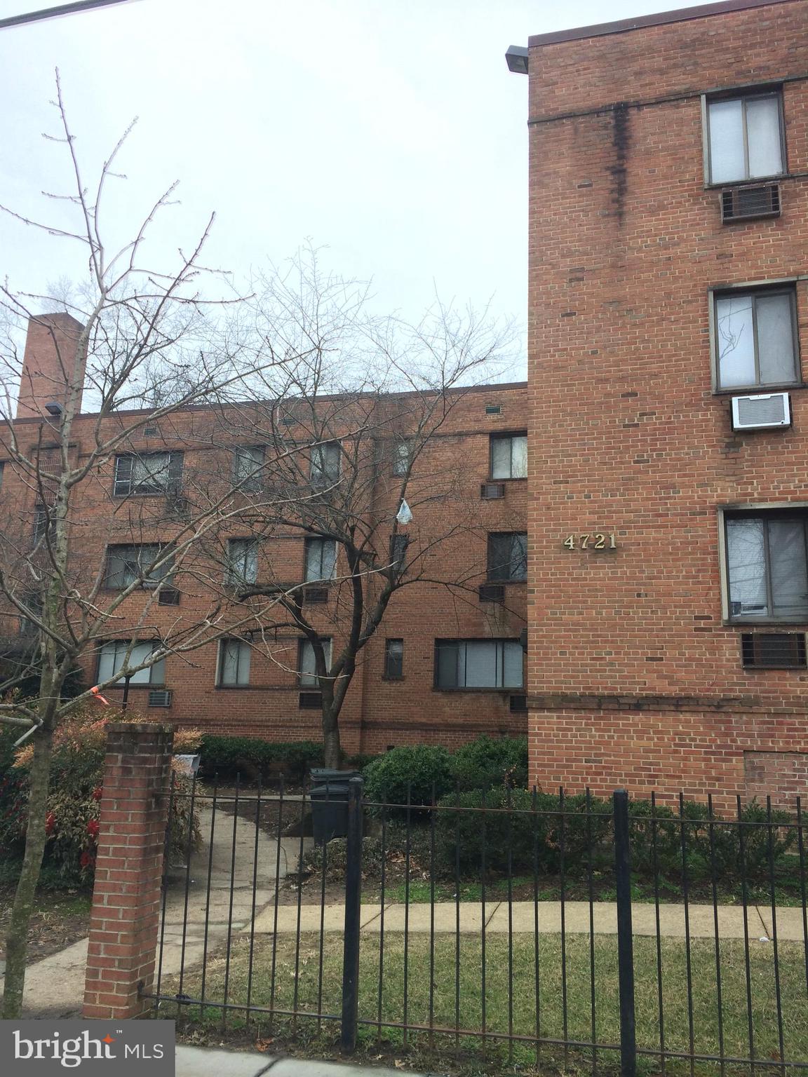 4721 1st Street Southwest, Unit 101 Washington, DC 20032 - Photo 12 of 12 a view of a brick house with a yard