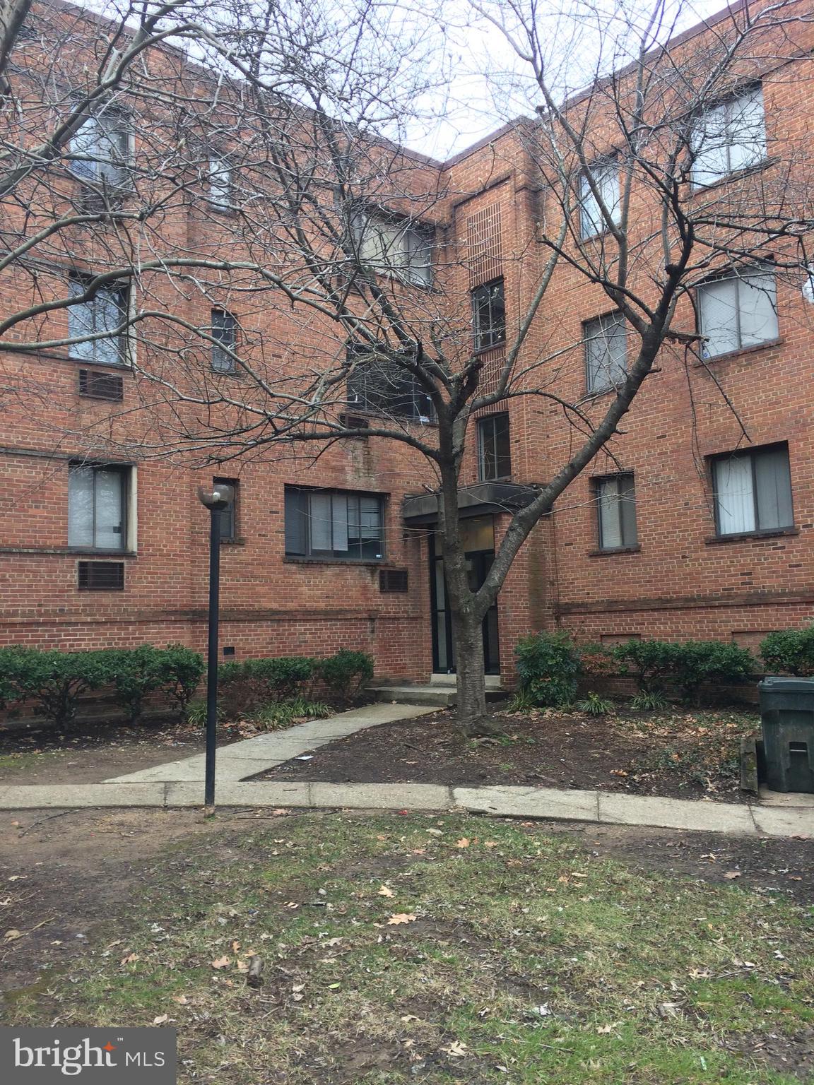 4721 1st Street Southwest, Unit 101 Washington, DC 20032 - Photo 3 of 12 a view of a house with a yard