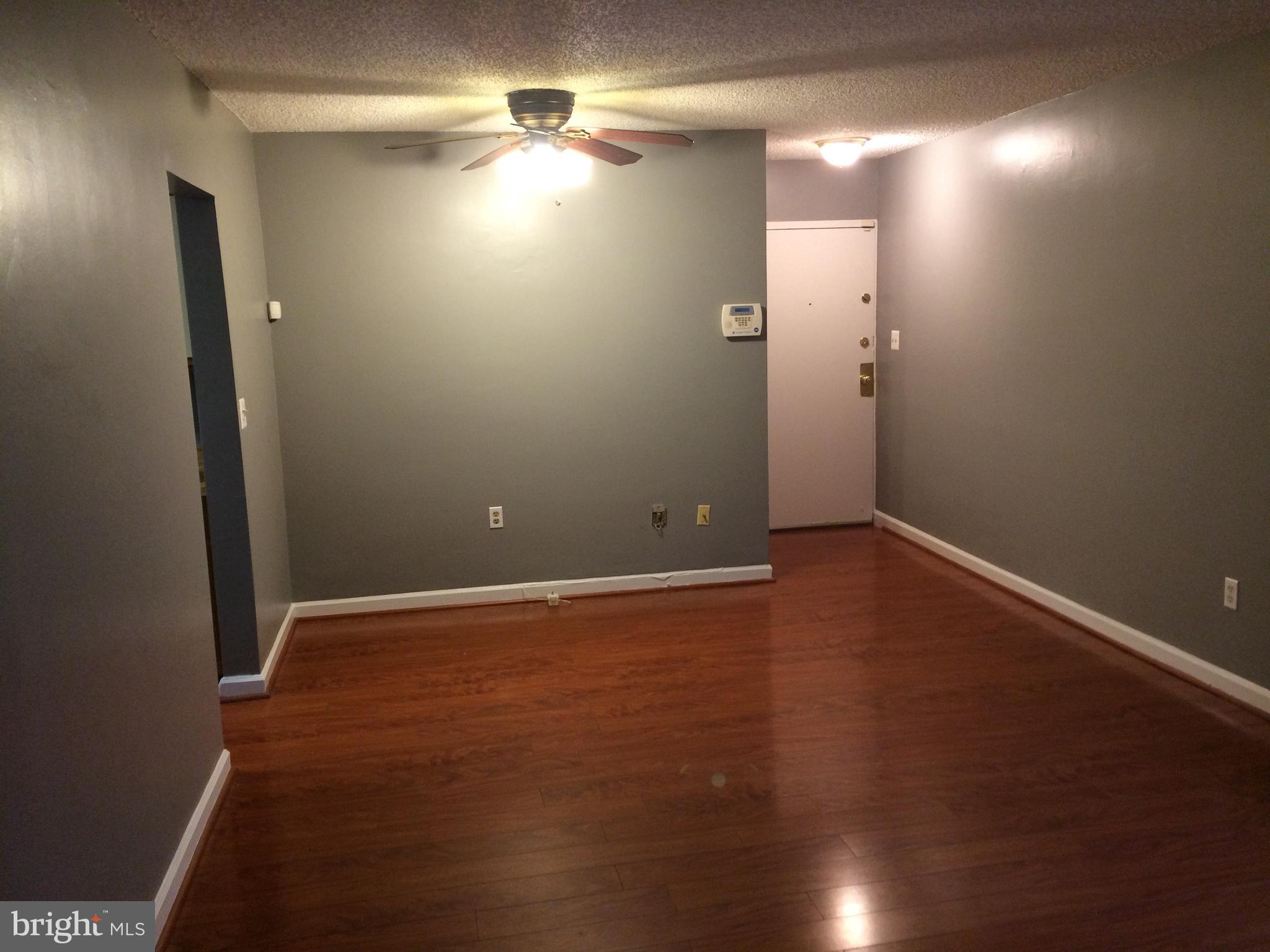 4721 1st Street Southwest, Unit 101 Washington, DC 20032 - Photo 6 of 12 a view of room with window and hardwood floor