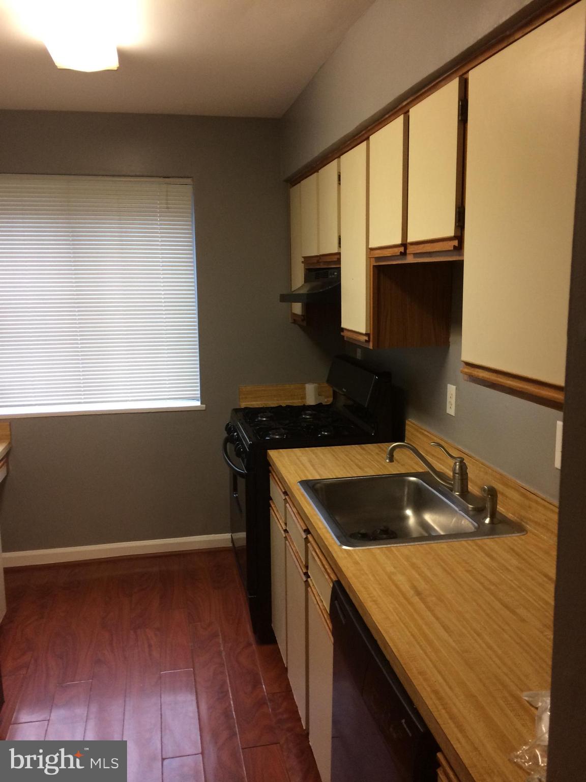 4721 1st Street Southwest, Unit 101 Washington, DC 20032 - Photo 10 of 12 a kitchen that has a sink in it