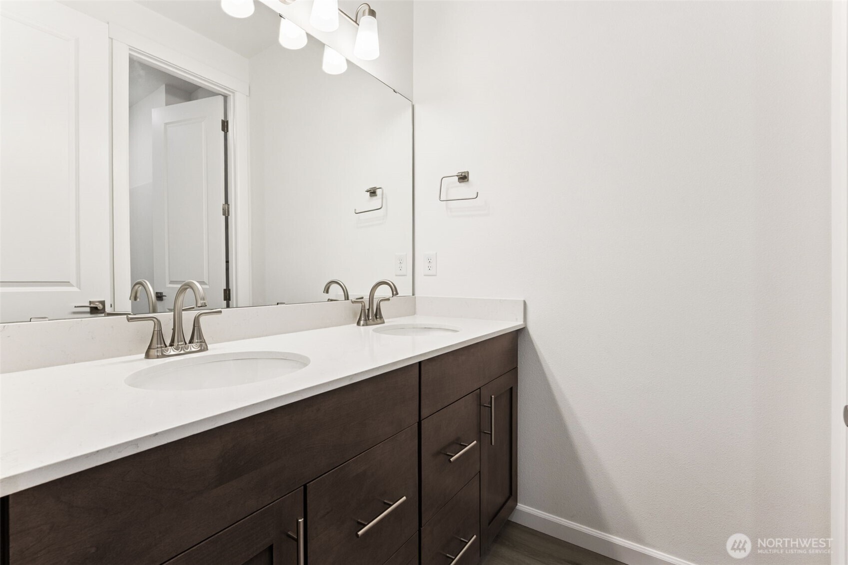 984 Tanner Avenue, Unit 101 Buckley, WA 98321 - Photo 12 of 17 a bathroom with a sink and a mirror