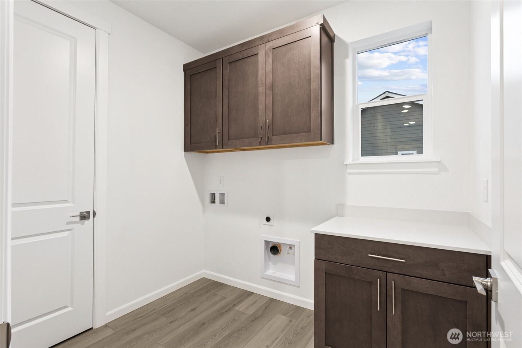 984 Tanner Avenue, Unit 101 Buckley, WA 98321 - Photo 13 of 17 a room with a sink and a mirror