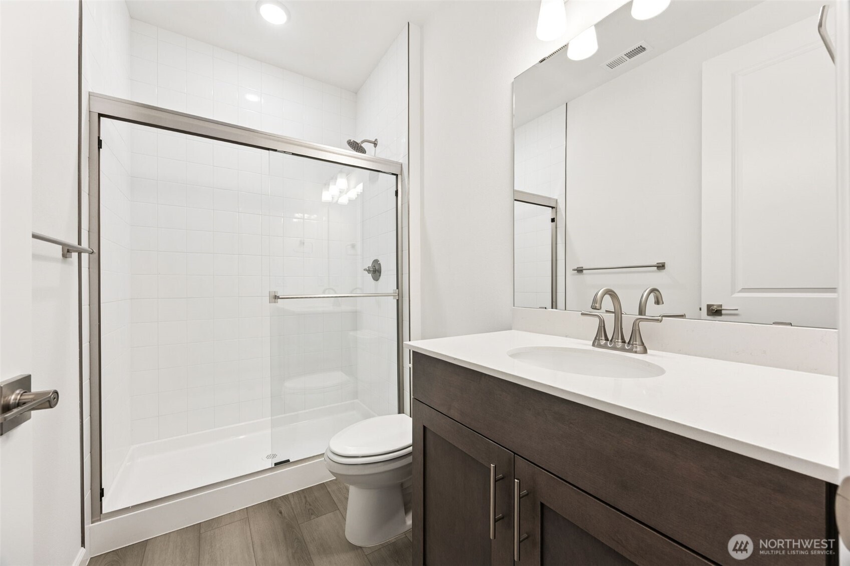 984 Tanner Avenue, Unit 101 Buckley, WA 98321 - Photo 4 of 17 a bathroom with a sink a toilet and shower