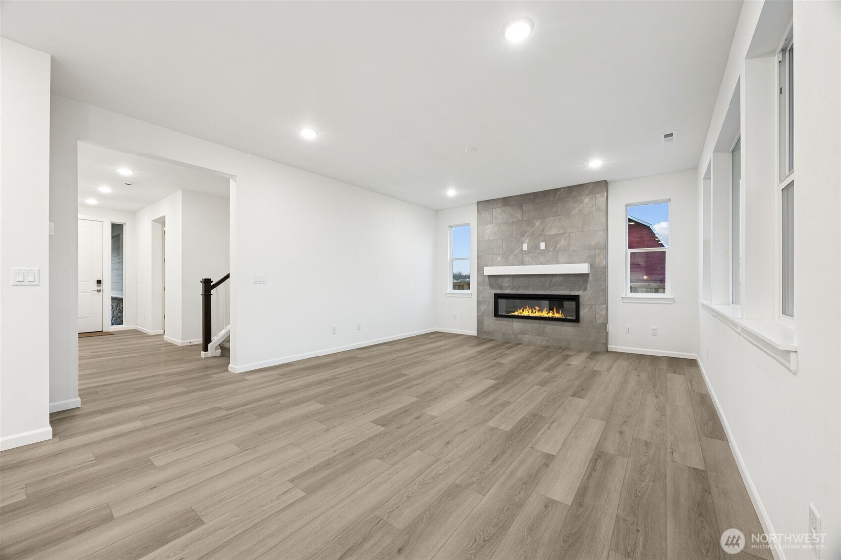 984 Tanner Avenue, Unit 101 Buckley, WA 98321 - Photo 6 of 17 a view of empty room with a fireplace and wooden floor
