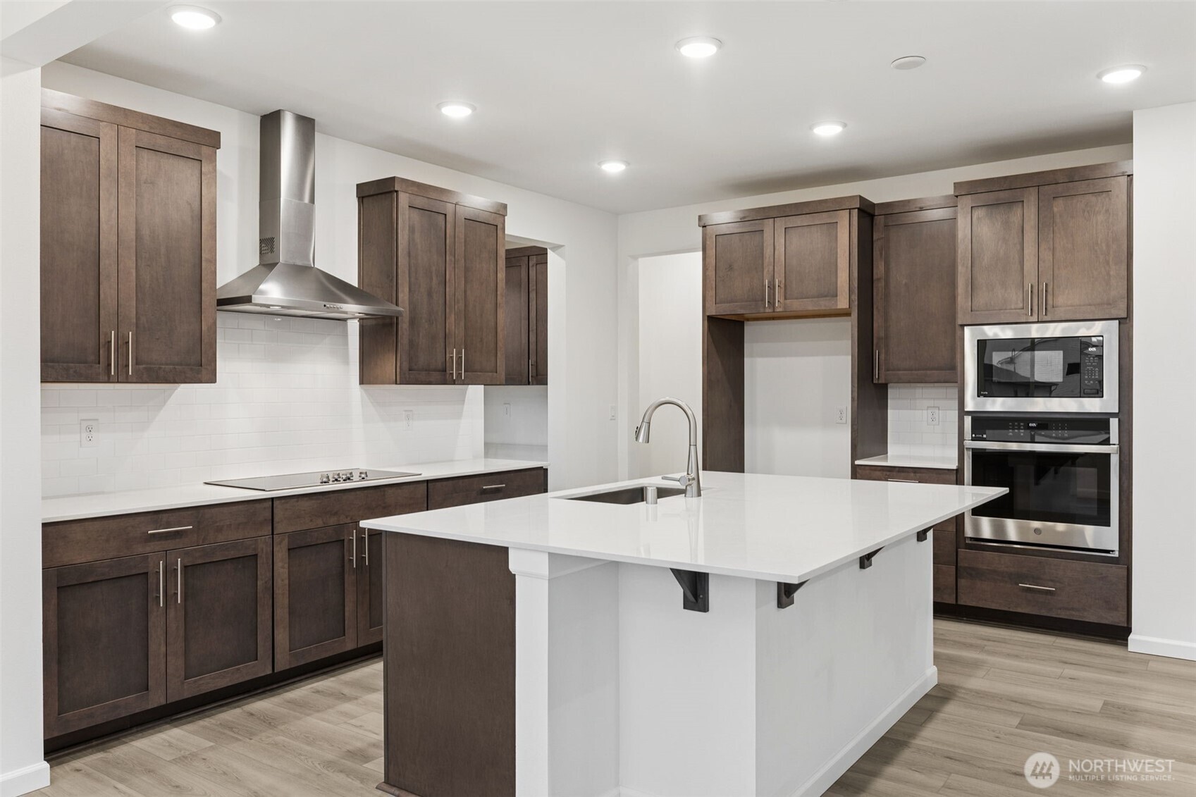 984 Tanner Avenue, Unit 101 Buckley, WA 98321 - Photo 9 of 17 a kitchen with stainless steel appliances a sink and a refrigerator