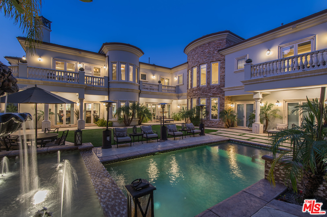 15506 Meadowgate Road Encino, CA 91436 - Photo 1 of 50 a view of a swimming pool with a patio