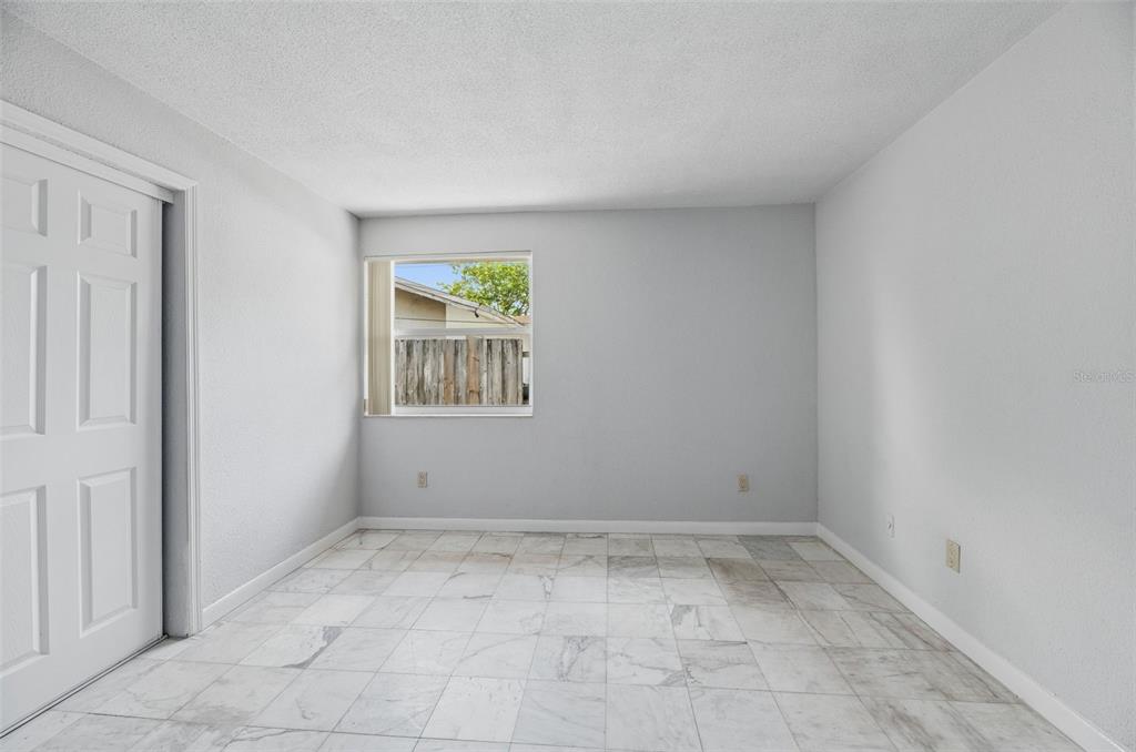 5735 Hayes Street Hollywood, FL 33021 - Photo 11 of 40 a view of room with window and hallway