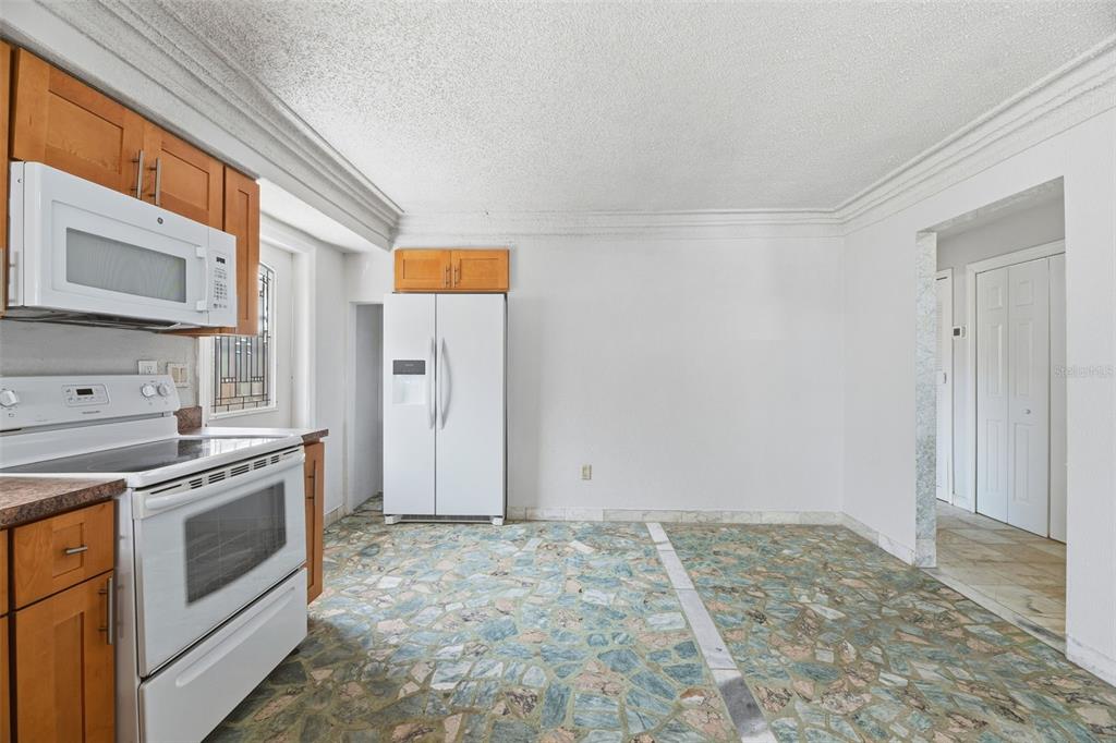 5735 Hayes Street Hollywood, FL 33021 - Photo 15 of 40 a view of a kitchen with a stove top oven